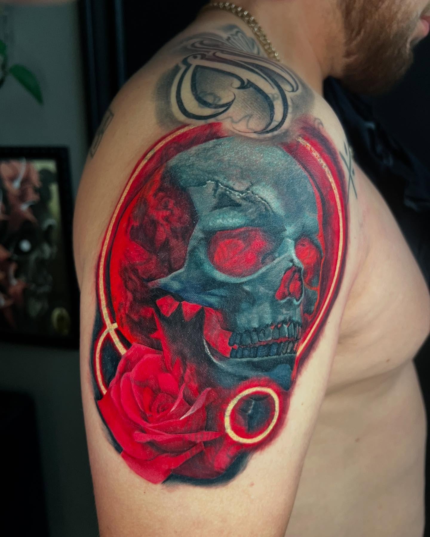 Color realism skull and rose tattoo by Juan Palomares