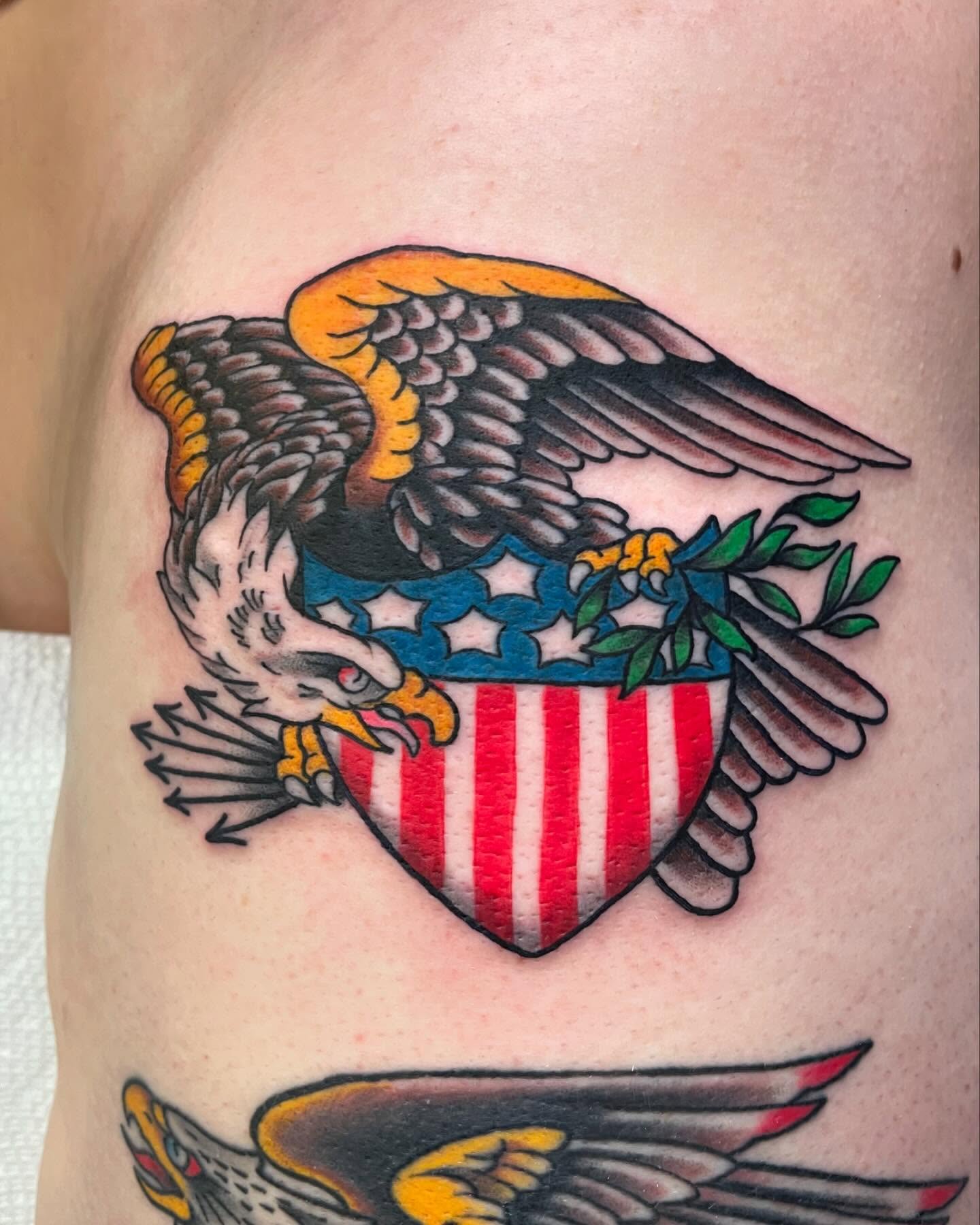 American Traditional eagle and shield tattoo by Manny Abete