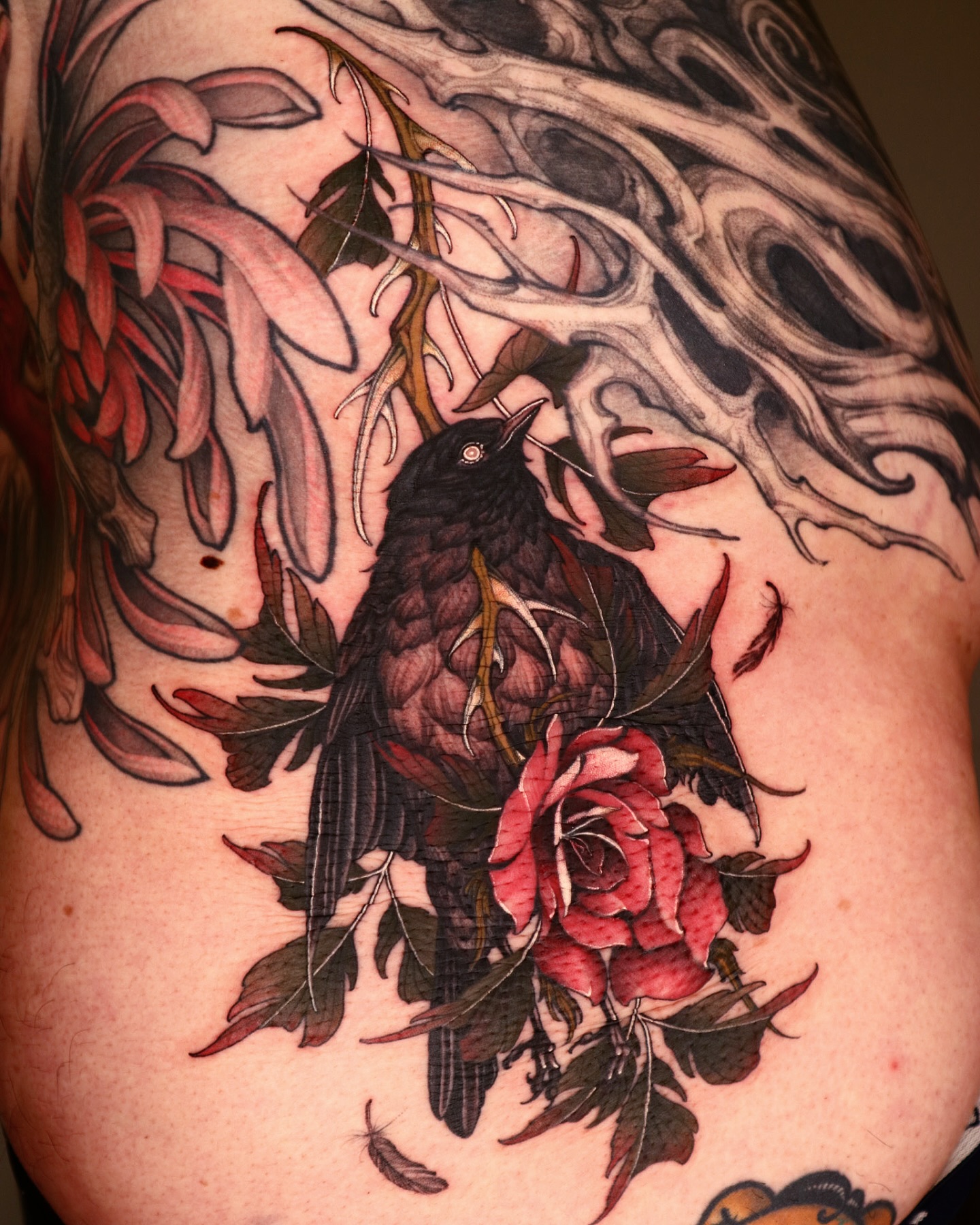 Illustrative bird and rose tattoo by Swan