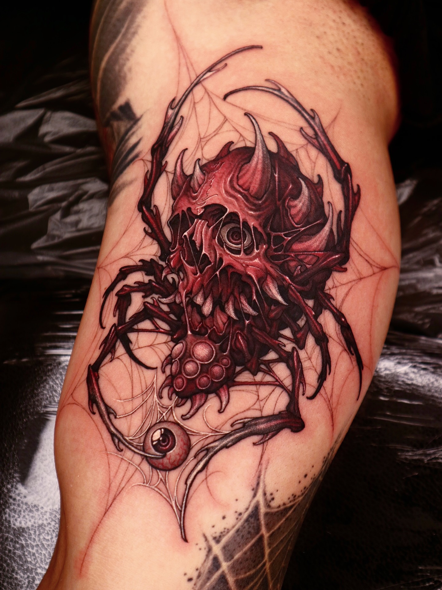 Illustrative skull and spider tattoo by Swan