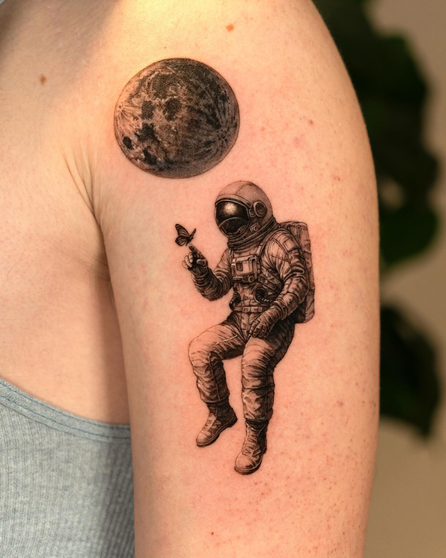 Fine line micro-realism astronaut tattoo by Zake
